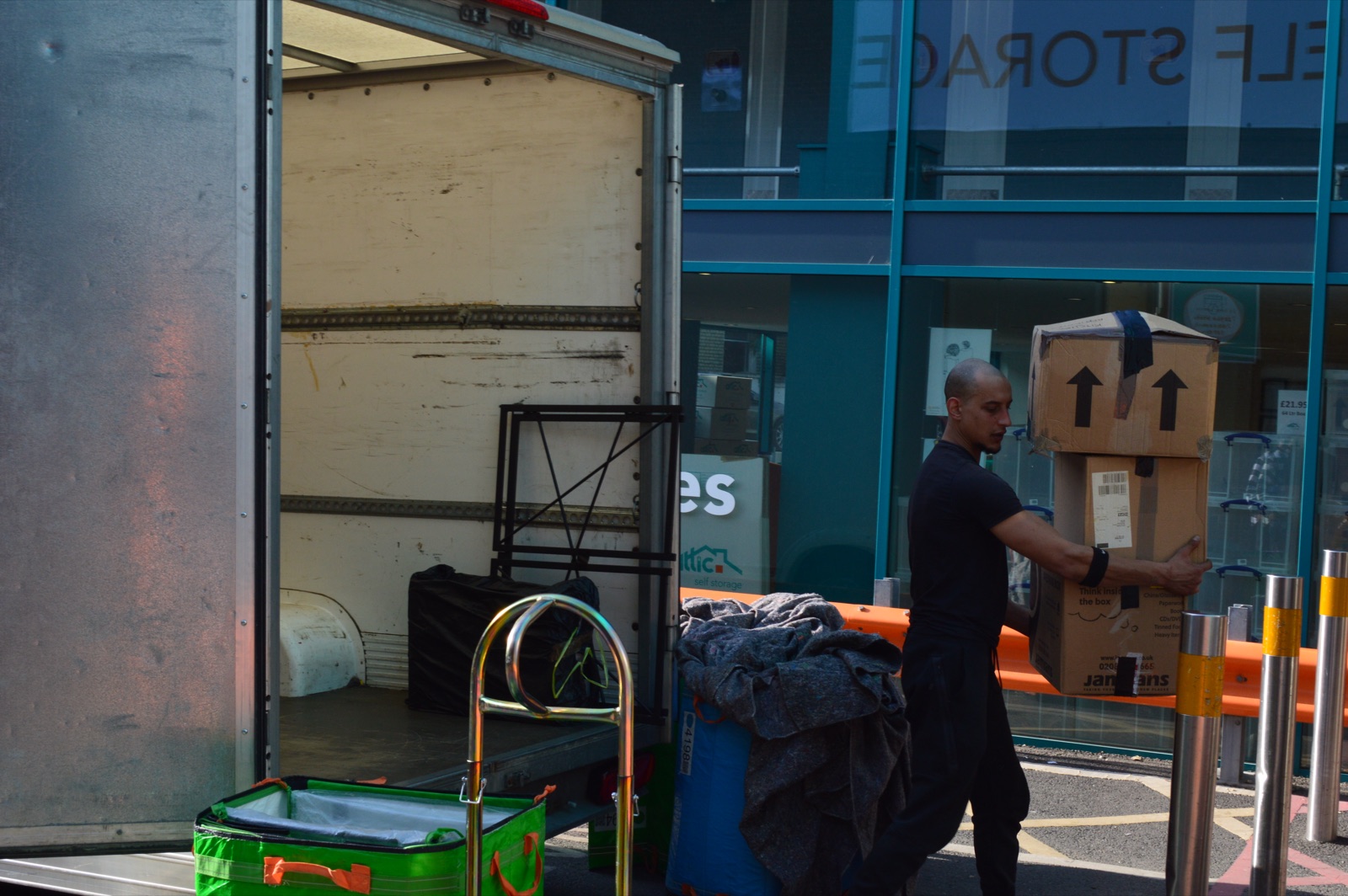 Mover carrying boxes during a home removal