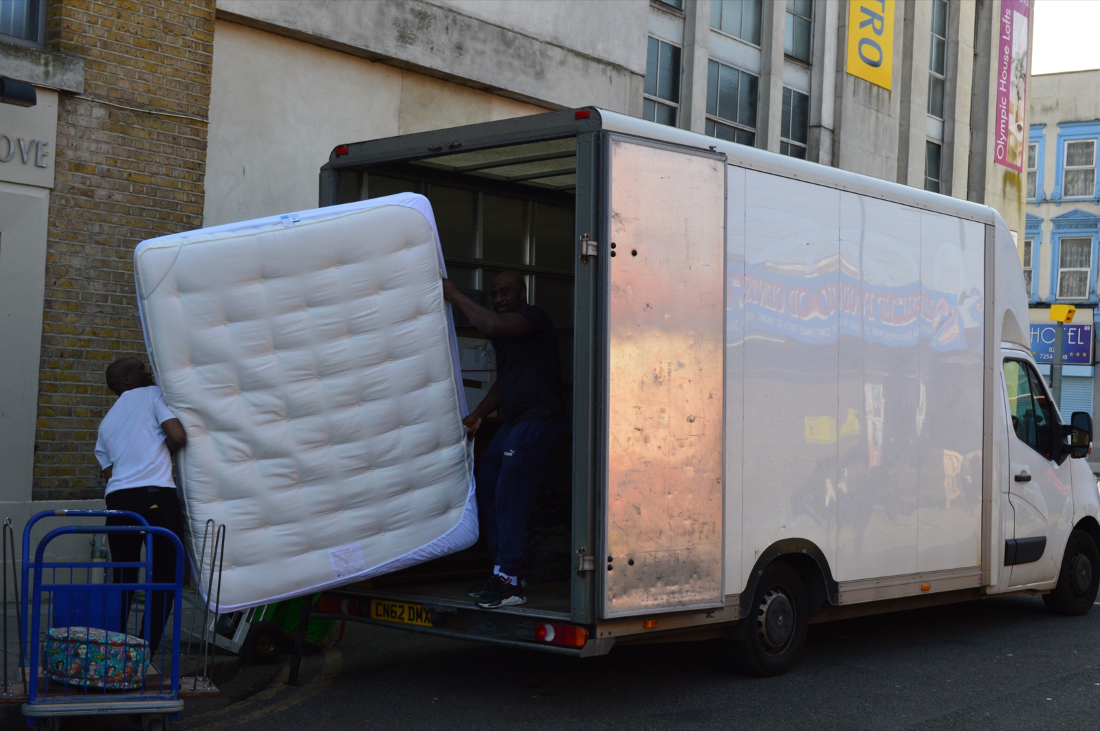 Mattress being loaded carefully into a Luton van