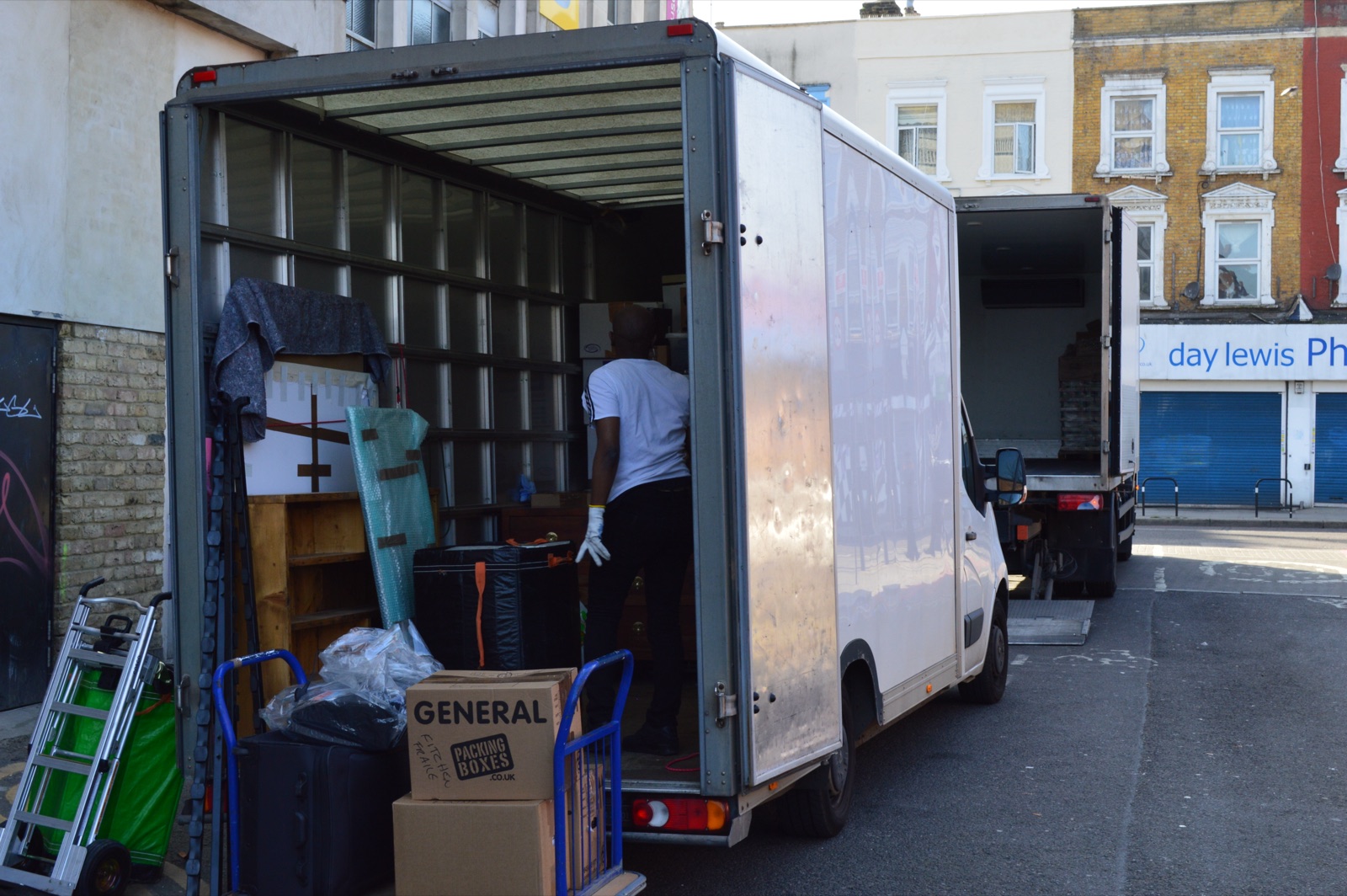 Packed Luton van with boxes and furniture secured for the journey