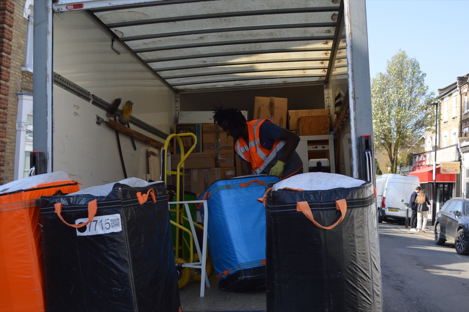 Removal bags and boxes prepared for loading into a Luton van