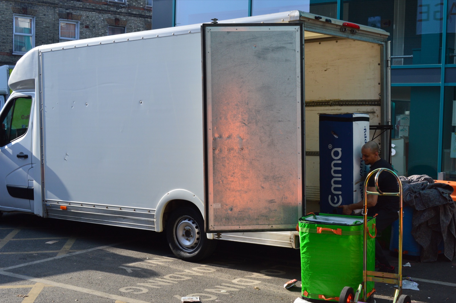 Side view of a removal van during a loading job