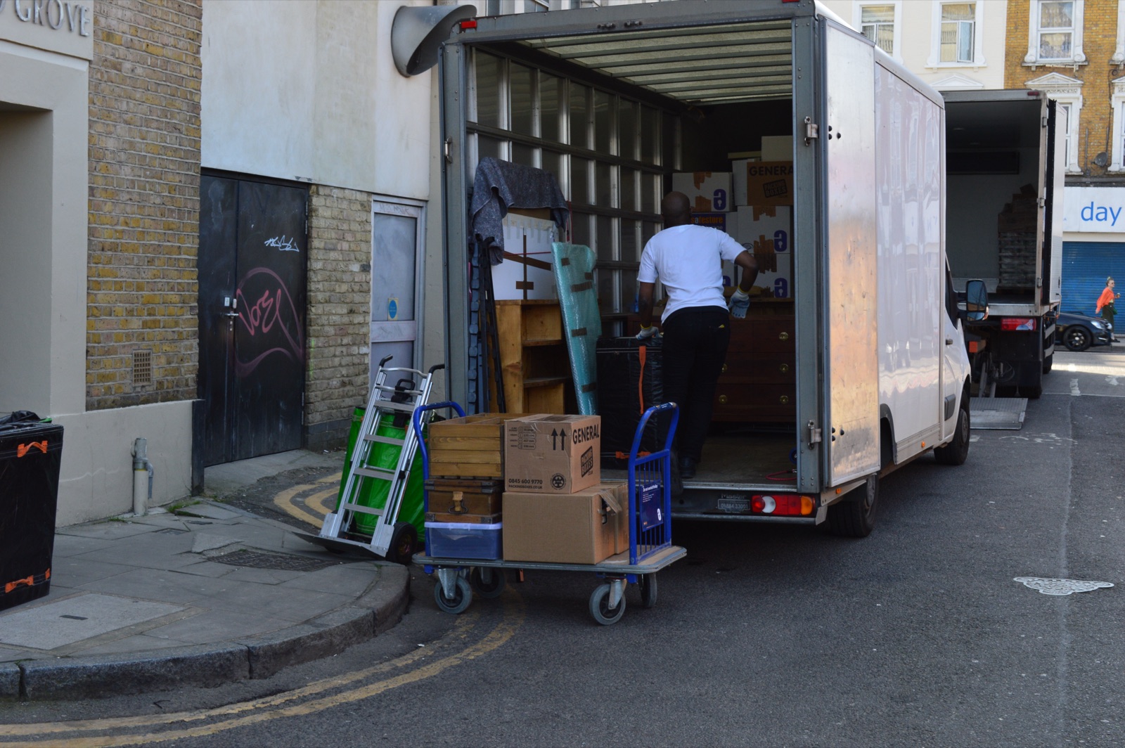 Luton van loading on a residential London street
